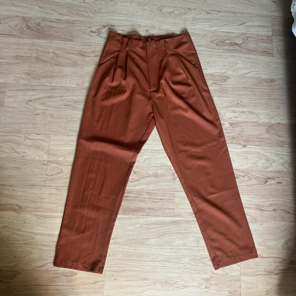 Burnt orange and red trousers with pockets